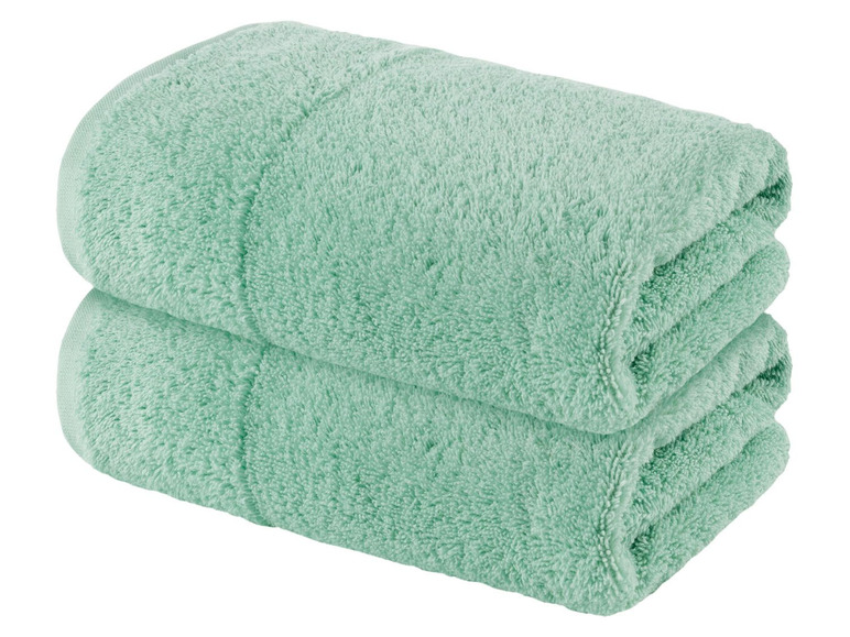 Zwei hellgrüne Handtücher.