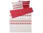 Ein rot-weißes Bettwäsche-Set mit Weihnachtsmotiv.