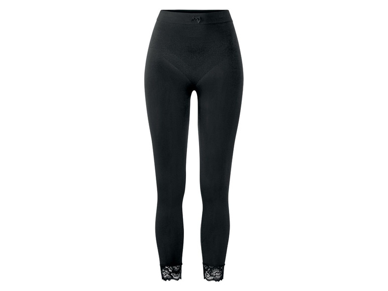 Schwarze Leggings mit Spitze am Saum.