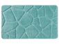 Eine türkisfarbene Badematte mit geometrischem Muster.