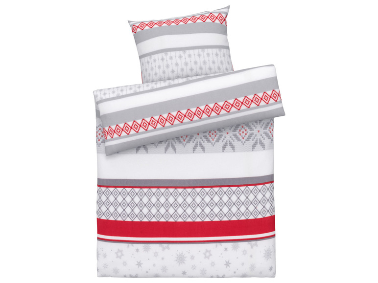Ein weißer Bettbezug mit grauen und roten Streifen und Schneeflocken.