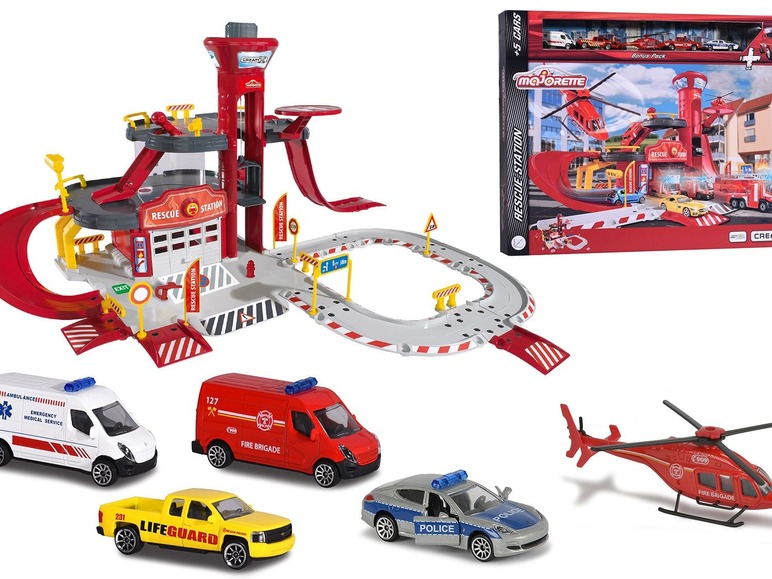 Ein Majorette Rettungsstation Spielset mit einem Feuerwehrauto, einem Krankenwagen, einem Polizeiauto, einem Rettungsboot und einem Hubschrauber.