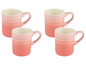 Vier rosafarbene Le Creuset Kaffeetassen mit Ombre-Effekt.