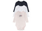 Drei langärmelige Babybodys: schwarz, weiß mit Punkten und rosa mit 'Happy'-Aufdruck.