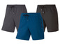 Drei Shorts, darunter eine blaue mit Reißverschluss-Tasche.