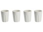 Vier weiße Gläser mit gerippter Struktur.