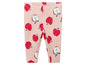 Rosa Leggings mit rotem Apfelmuster.