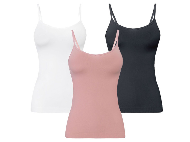 Drei Tanktops in Weiß, Rosa und Schwarz.