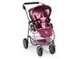 Ein rosa Kinderwagen mit Sternenmuster für Puppen.