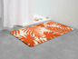 Badematte mit orangenen Palmenblättern
