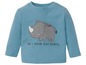 Ein hellblaues Baby-Shirt mit einem Nashorn-Motiv und dem Schriftzug 'let's have fun today'.