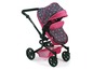 Ein rosa Kinderwagen mit Sternmuster für Puppen