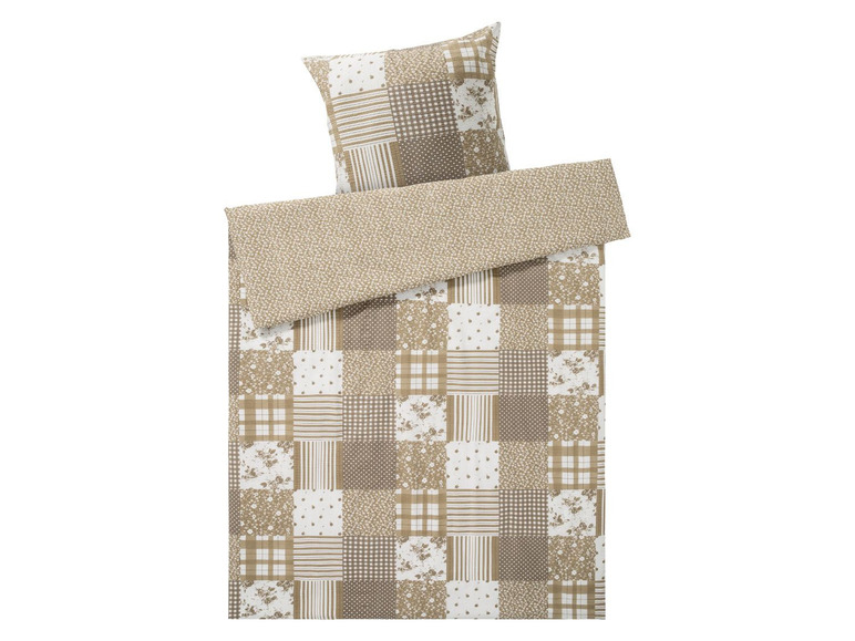 Beige Bettbezug mit Patchwork-Muster.