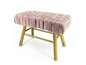 Ein rosa Samt-Hocker mit Holzbeinen.