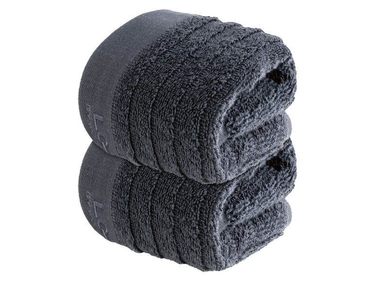 Zwei dunkelgraue Handtücher, gefaltet.