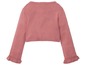 Rosa Strickjacke mit Rüschenärmeln.