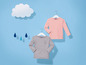 Zwei Langarmshirts für Kinder, eines rosa und eines grau mit einem Wolken- und Regenschirm-Motiv.