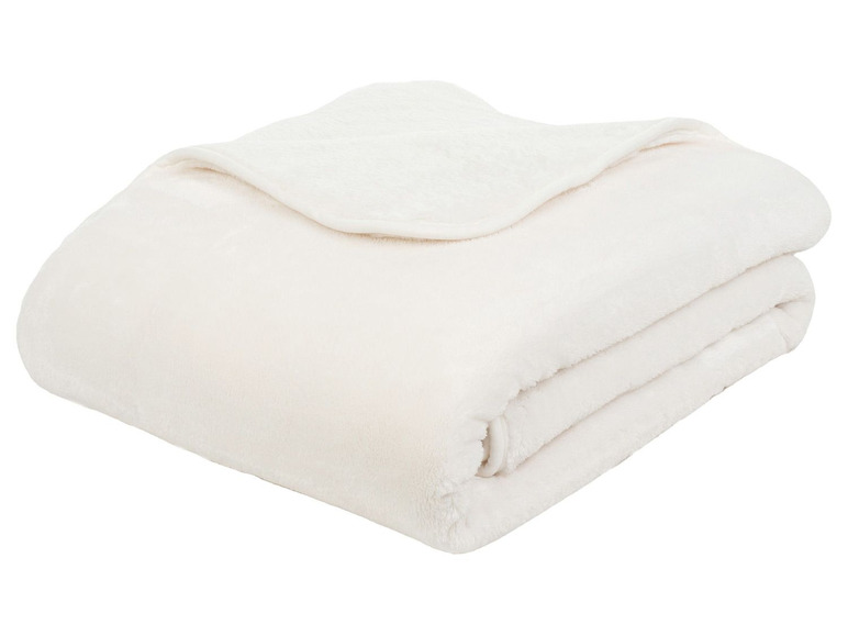 Eine weiße, weiche Fleece-Decke, gefaltet.