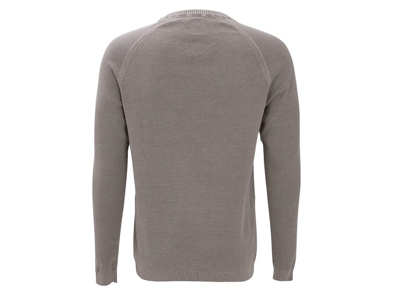 Ein grauer Pullover mit langen Ärmeln.