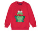Ein roter Kinderpullover mit einer Frosch-Applikation von Lupilu.