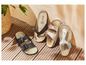Drei Paar Natural Walk Sandalen in Schwarz, Beige und Weiß.