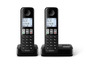 Zwei schnurlose Philips Telefone mit einer Basisstation.