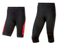 Zwei schwarze Fahrradhosen mit roten Akzenten.
