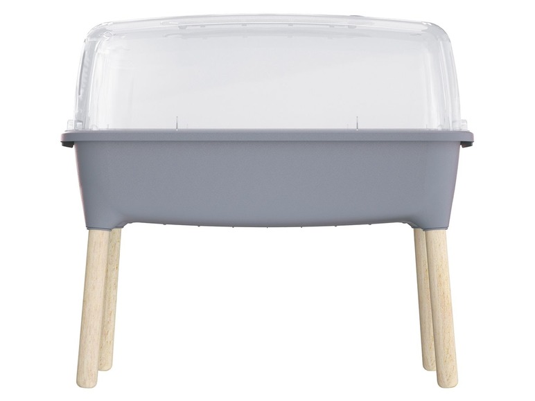 Ein grauer Mini-Gewächshaus mit Holzbeinen.