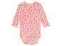 Ein rosa Babybody mit roten Herzen.