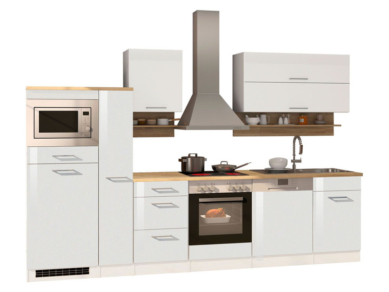 Weiße Küche mit Backofen, Mikrowelle und Geschirrspüler.