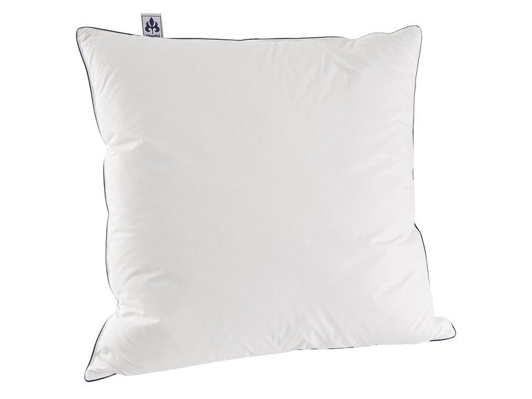 Ein weißes Kissen mit blauem Rand der Marke Incavo.