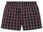 Ein Paar schwarze Boxershorts mit roten und weißen Karos.