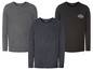 Drei Langarmshirts von Livergy, eines mit Tasche, eines mit dem Aufdruck 'Adventure is out there'.
