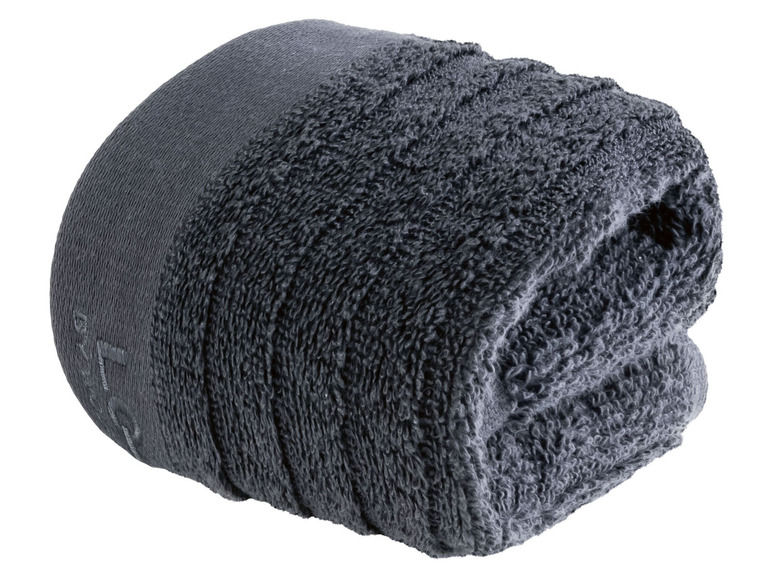 Ein dunkelgraues Handtuch, zusammengerollt.