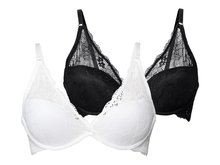 Zwei schwarze und weiße BHs mit Spitze.