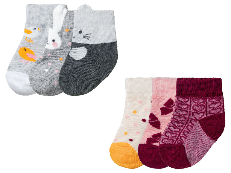 Drei Paar Babysocken mit Tiermotiven und Blumen