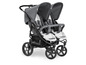 Ein grauer Hauck Duo-Kinderwagen mit großen Rädern.