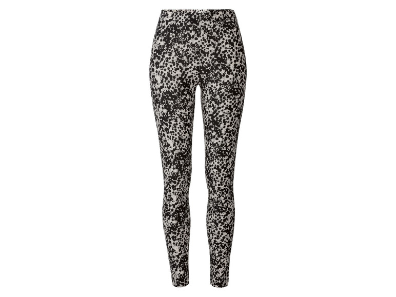 Schwarze Leggings mit weißem Punkte-Muster.