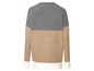 Ein gestrickter Pullover in Grau, Beige und Weiß.