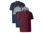 Drei Poloshirts von Livergy in dunkelblau, grau und rot.