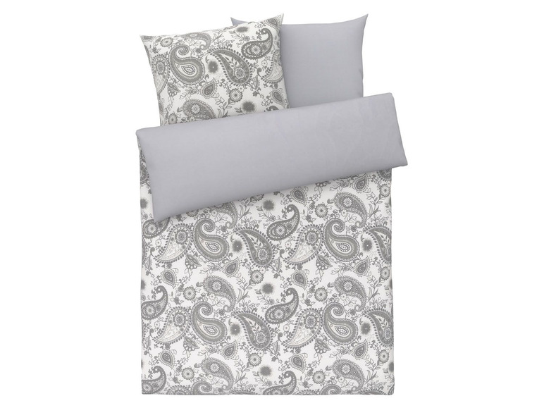 Ein Bettwäsche-Set in Grau und Weiß mit Paisley-Muster.