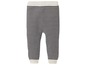 Schwarz-weiße gestreifte Baby Leggings.