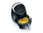 Eine schwarze Severin Airfryer mit Pommes Frites.