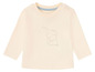Ein cremefarbener Baby-Pullover mit einem Elefanten-Motiv.