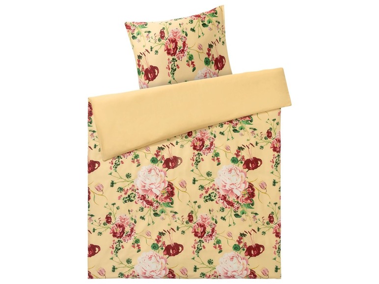 Ein Bettbezug mit Blumenmuster in Rosa und Rot.