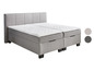 Ein graues Boxspringbett mit zwei Schubladen.