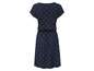 Ein dunkelblaues Kleid mit kurzen Ärmeln und weißen Punkten.