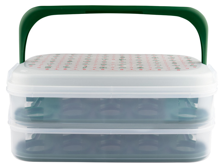 Eine weiße Aufbewahrungsbox mit grünem Griff und zwei Ebenen.