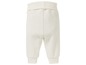 Weiße Babyhose mit elastischem Bund.