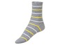 Graue Socke mit gelben und weißen Streifen.